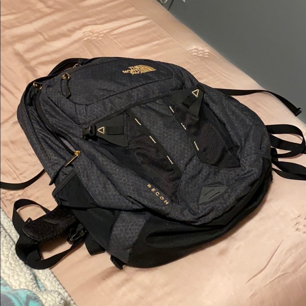 north face women’s recon black and gold backpack